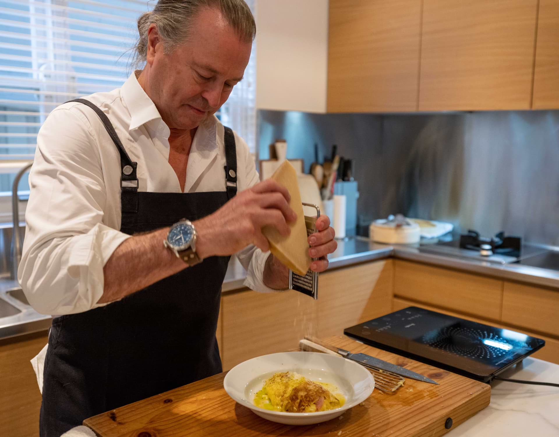Neil Perry cooking is his kitchen for Lexus Ambassadors at home